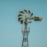 Setting Rates - blue and white windmill near white building