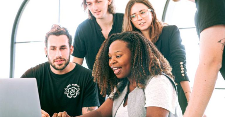 Marketing Freelancer - Woman Sharing Her Presentation with her Colleagues