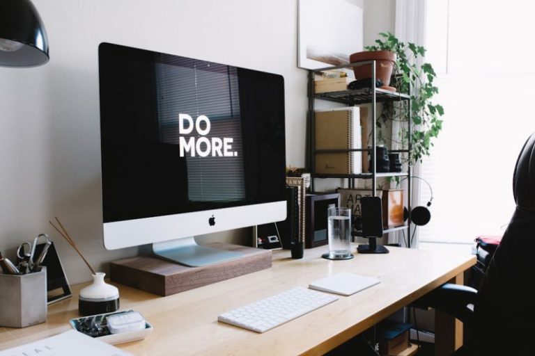 Personal Brand - silver iMac with keyboard and trackpad inside room