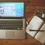 Managing Stress - turned on MacBook Air beside white notebook