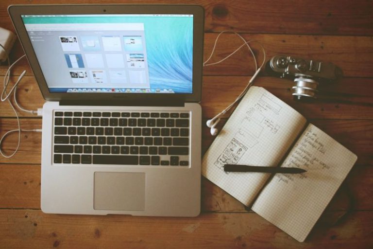 Managing Stress - turned on MacBook Air beside white notebook