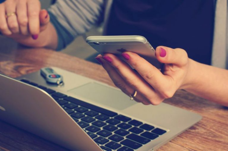 Technology Impact - woman holding silver iPhone 6
