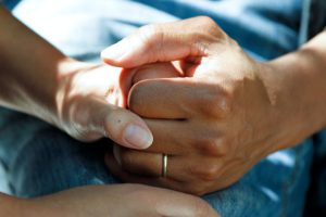 Self-care Importance - person wearing gold wedding band