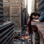 Overcoming Burnout - woman leaning on top building rail during daytime