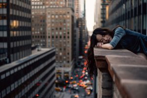 Overcoming Burnout - woman leaning on top building rail during daytime