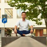 Freelancing Balance - man in white dress shirt sitting on gray concrete bench during daytime