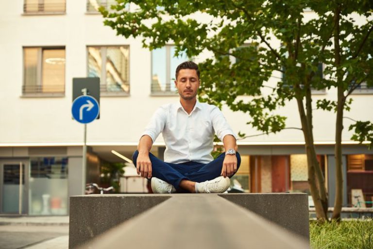 Freelancing Balance - man in white dress shirt sitting on gray concrete bench during daytime