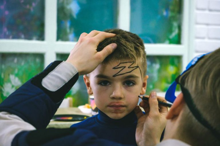 Creativity Leisure - a young boy is getting his hair cut