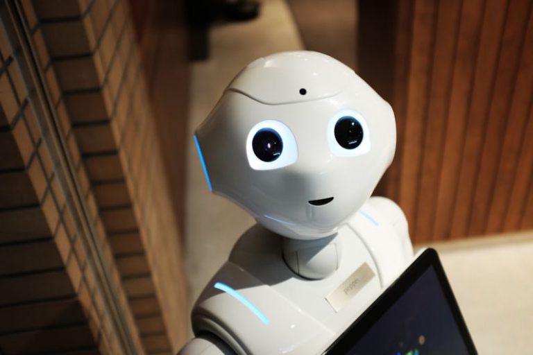 Future Work - white robot near brown wall