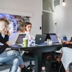 Tech Startup - 3 women sitting on chair in front of table with laptop computers