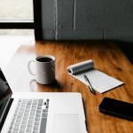 Job Trends - MacBook Pro, white ceramic mug,and black smartphone on table