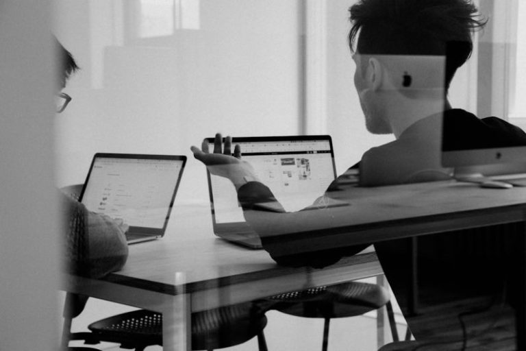 Co-working Spaces - man using MacBook
