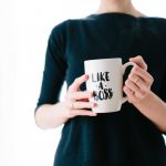 Personal Brand - woman holding white mug while standing