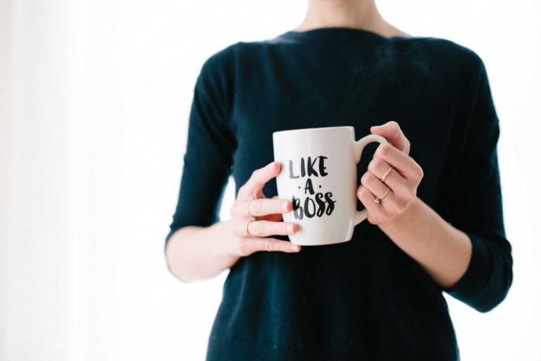 Personal Brand - woman holding white mug while standing