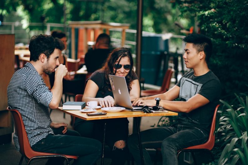 Networking Tips - photo of three person sitting and talking