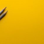 LinkedIn Creative - two gray pencils on yellow surface