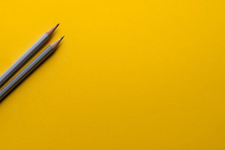 LinkedIn Creative - two gray pencils on yellow surface
