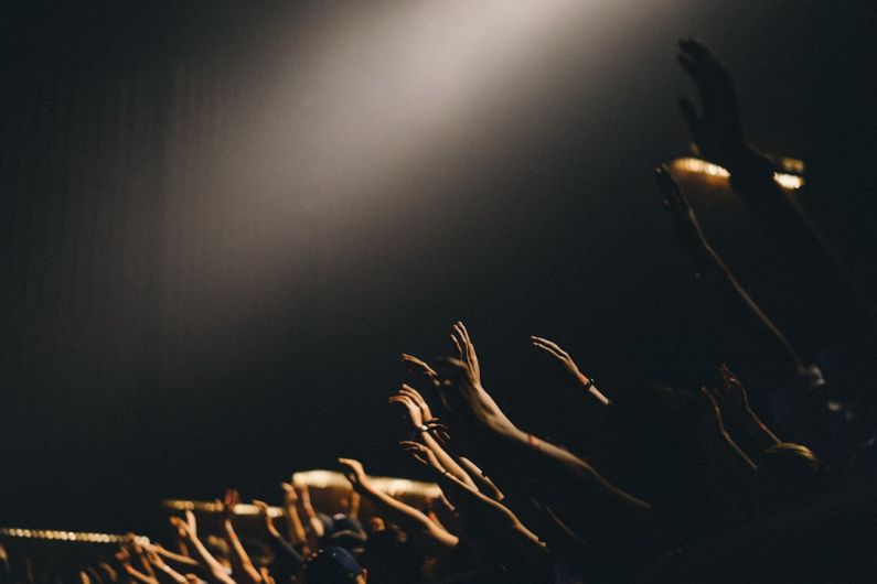 Industry Events - group of people waving their hands