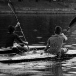 Competitors Collaborators - a couple of people riding on the back of a kayak