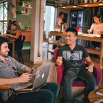 Introvert Networking - two men laughing white sitting on chairs