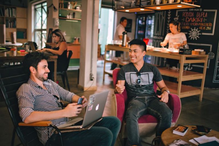 Introvert Networking - two men laughing white sitting on chairs