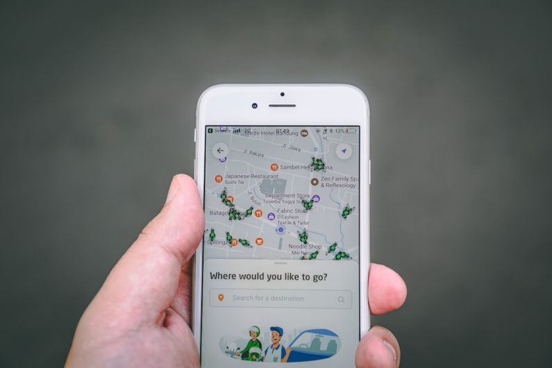 Gig Economy - person holding silver iPhone 6