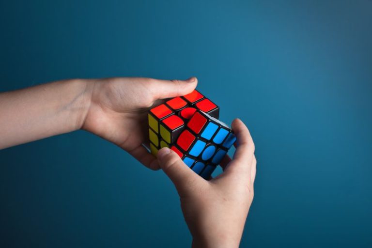 Problem-solving - person playing magic cube
