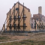 Building Resilience - a large building with a clock on the side of it