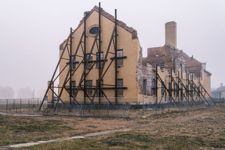 Building Resilience - a large building with a clock on the side of it