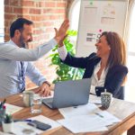 Teamwork Skills - man in white dress shirt sitting beside woman in black long sleeve shirt