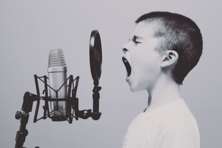 Presentation Skills - boy singing on microphone with pop filter