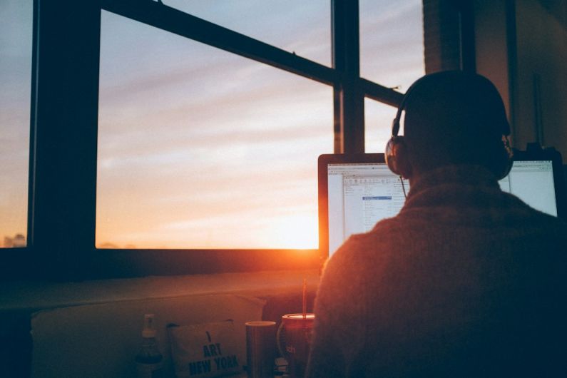 Future Work - man sitting facing monitor